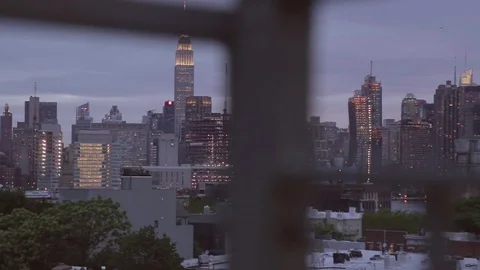 Night view to Manhattan skyline, through roof safety barriers. New York. Stock Footage 75281587