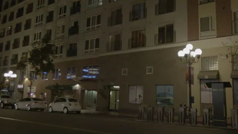 Night View of Modern Apartment Building and Street Stock Footage 343948405