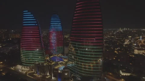 Night View of Modern Skyscrapers with Dynamic Colorful Lights Stock Footage 341882381