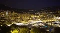 Night view of Monte Carlo in Monaco, illuminated houses and yachts in harbor 4k or 4k+ Resolution