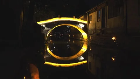 Night view of old stone illuminated bridge over the canal in chinese village Stock-Footage 252377416