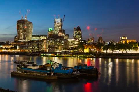 Night view over the thames river in london to the city with several new skysc Stock Photos