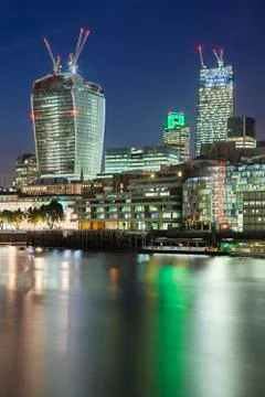 Night view over the thames river in london to the inner city with several new Stock Photos