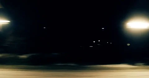 Night view from the passenger train to the almost empty station with two Stock Footage 84184952