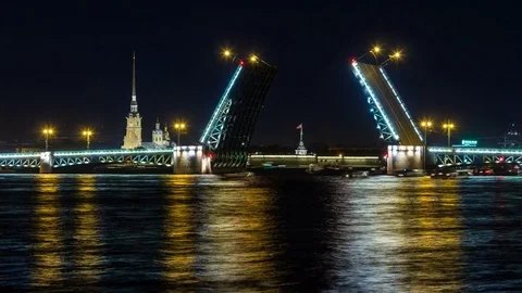 Night view on the Peter and Paul fortress and the Palace bridge lifting Stock Footage 77849196