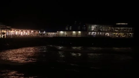 Night view of the pier and illuminated promenade on the beach Stock Footage 333018786