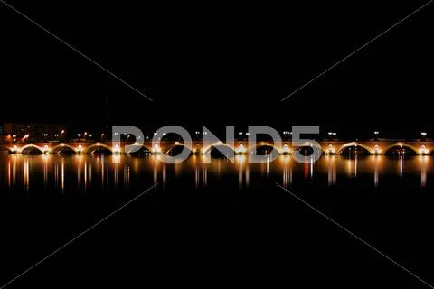 Night view of the pont de pierre (stone bridge) (1819-1822), bor Stock Photos