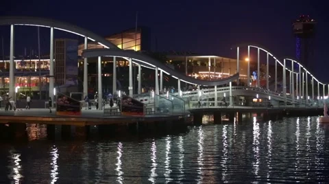 Night view of Rambla de Mar, footbridge modern design in the port of Barcelona. Stock Footage 50636339