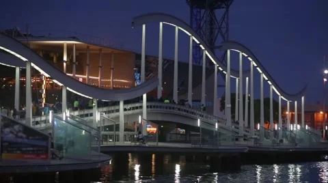 Night view of Rambla de Mar, footbridge modern design in the port of Barcelona. Stock Footage 50711175