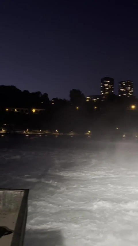 Night view of Rhine Falls area with illuminated riverside in Schaffhausen Stock Footage 338202288