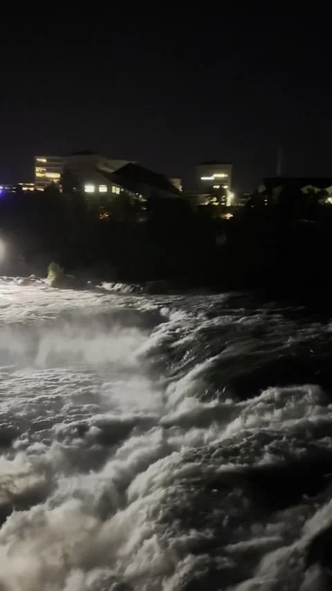 Night view of Rhine Falls area with illuminated riverside in Schaffhausen Stock Footage 338202292