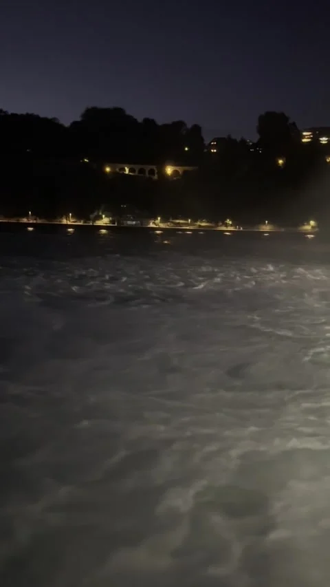 Night view of Rhine Falls area with illuminated riverside in Schaffhausen Stock Footage 338290380
