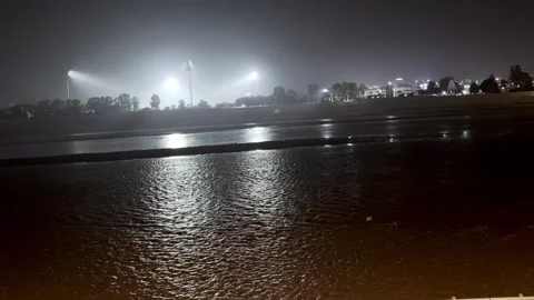 Night View of River Water in City with Flood Lights Video stock 344554914