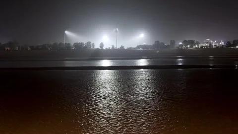 Night View of River Water in City with Flood Lights Vidéo 344555004