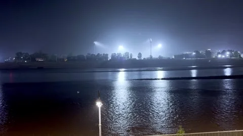 Night View of River Water in City with Flood Lights Stock-Footage 344555012