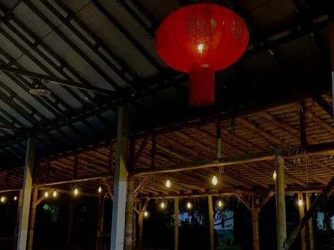 Night View of Rustic Bamboo Pavilion with Lanterns at Tanjung Lesung Beach Stock Photos