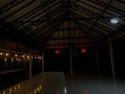 Night View of Rustic Bamboo Pavilion with Lanterns at Tanjung Lesung Beach Stock Photos