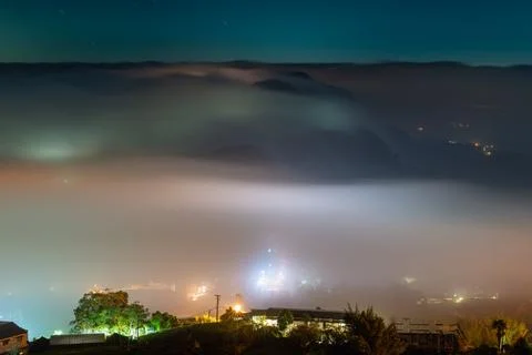 Night View of Sea of Clouds over Mountain Village in Chiayi, Taiwan Fotos Stock