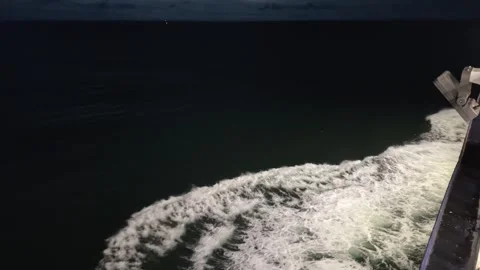 Night view of sea from ship side, waves near hull Stock Footage 345663532