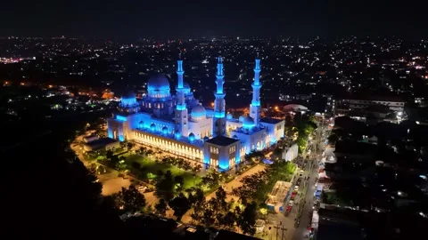 Night view of Sheikh Zayed Grand Mosque with lights illuminating the mosque Stock Footage 304303691