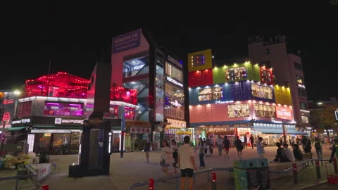 Night view of shops built with shipping containers in Hongdae Walking Street Stock Footage 248495121