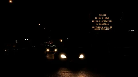 Night view smart motorways screen display with text police drink and drug drive Vídeos de archivo 99712855