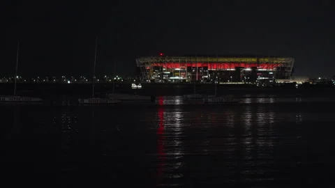 Night view of Stadium 974 and Qatar Sails boats in Doha harbor. Stock Footage 339215373