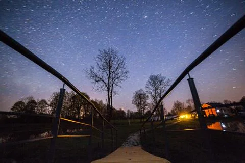 Night view of starry sky on the small bridge Stock Photos