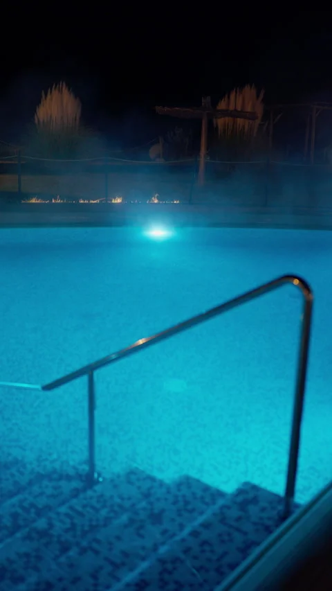 Night View of Steaming Thermal Pool with Blue Light Video stock 335055895