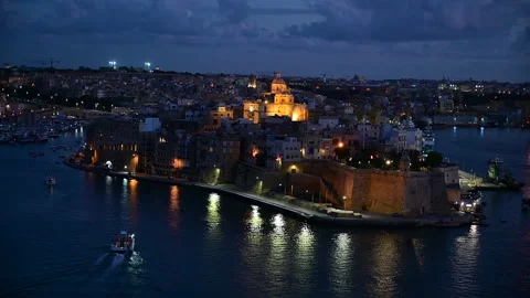 Night view of Three Cities (Cospicua, Senglea and Vittoriosa) from Valletta Stock Footage 221778582