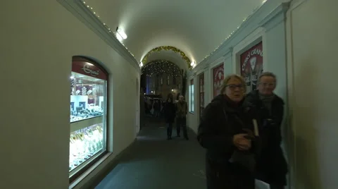 Night view of tourists walking inside the Art Passage on Christmas in Prague Stock Footage 60728976