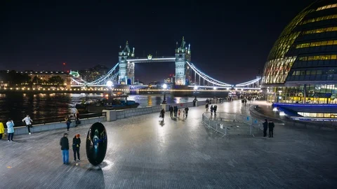 Night view of Tower Bridge, black egg shaped sculpture on the South Bank and Stock Footage 108009216