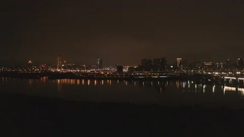 Night view of the wide river over busy bridge Stock Footage 103170876