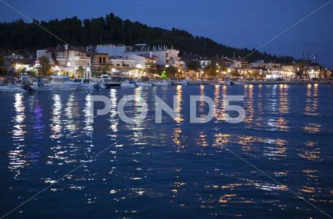 Night village sea Stock Photos