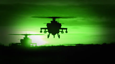 Night Vision of 3 Apache AH-64 Gunship Helicopters Stock Footage