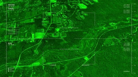 Night vision aerial  surveillance flyover of the outskirts of a rural town Stock Footage 52492439
