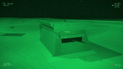 Night vision concrete bunker on a forward pad Stock Footage 342297618