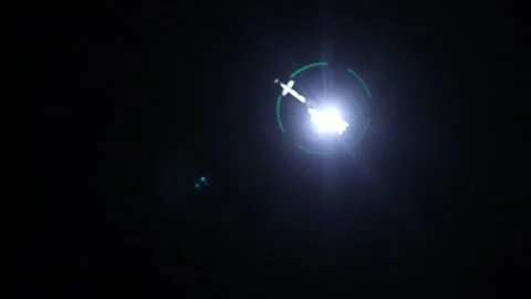 Night vision firefighting helicopter takes water from the sea. Stock Footage 159379978