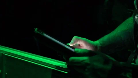 Night vision imagery of airman using touchscreen computer during airdrop Stock Footage 98342511