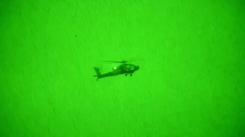 Night vision imagery of Apache helicopter in flight Video stock 90645230