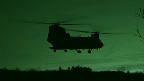 Night vision imagery of CH-47 Chinook coming in to land for exercise Rock Hammer Stock-Footage 101377259
