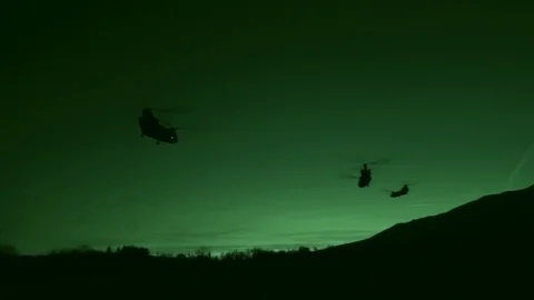 Night vision imagery of CH-47 Chinooks in flight during exercise Rock Hammer Stock Footage 101377269