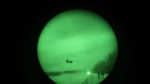 Night vision imagery of CH-47 Chinook helicopters taking off from snow  Video stock 237603734