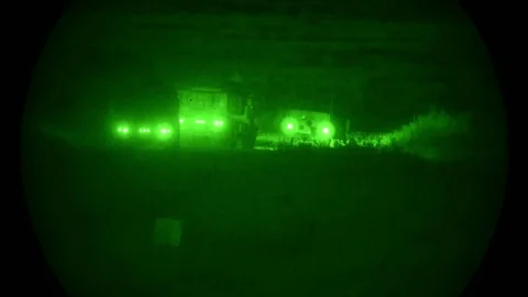Night vision imagery of high mobility artillery rocket system (HIMARS) driving Video stock 91126602
