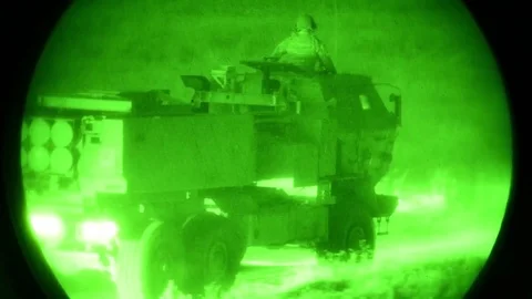 Night vision imagery of HIMARS being driven Vídeos de archivo 91126600