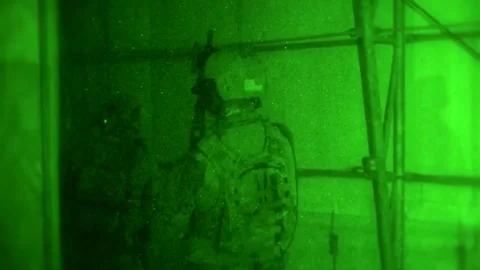 Night vision imagery of Special Forces soldiers conducting close quarter battle  Видео 209492403