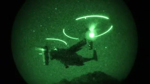 Night vision imagery U.S. Marines MV-22 Osprey tiltrotor aircraft landing Stock Footage 274259552