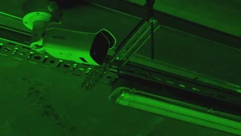 Night vision security camera hangs on roof inside parking or office Stock Footage 170936245