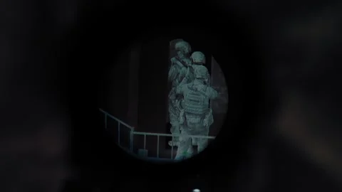 Night vision sniper scope, sniper sits in ambush on the rooftop Stock Footage 327460251