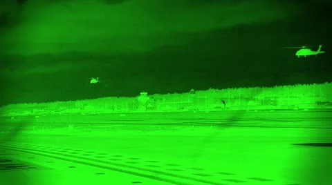 Night Vision View of Black Hawk Helicopters Flying Low at Night Stock Footage 10861247